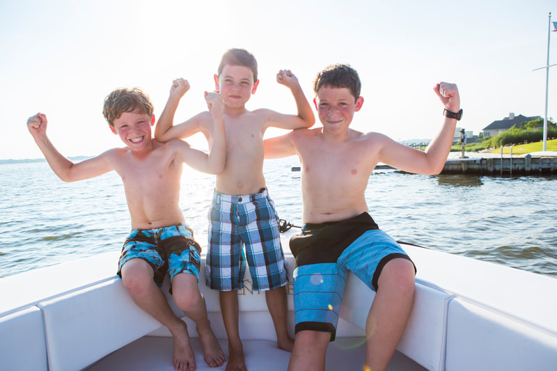 Photograph of Boys in swimsuits Flexing Muscles