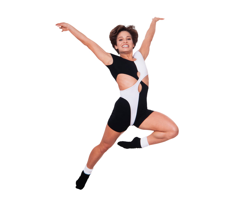 Photo of Olympic Gold Medal Winner Mary Lou Retton in White and Black Leotard Jumping in the Air on white background